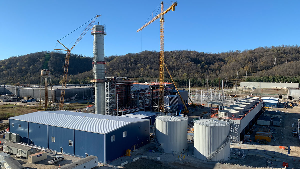 Power plant construction – placing top section of exhaust stack at 223 feet above site elevation