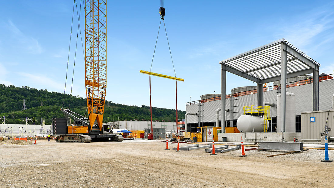 Construction progress - cooling tower chem feed area, 11,000-ton crawler crane used for HRSG modules