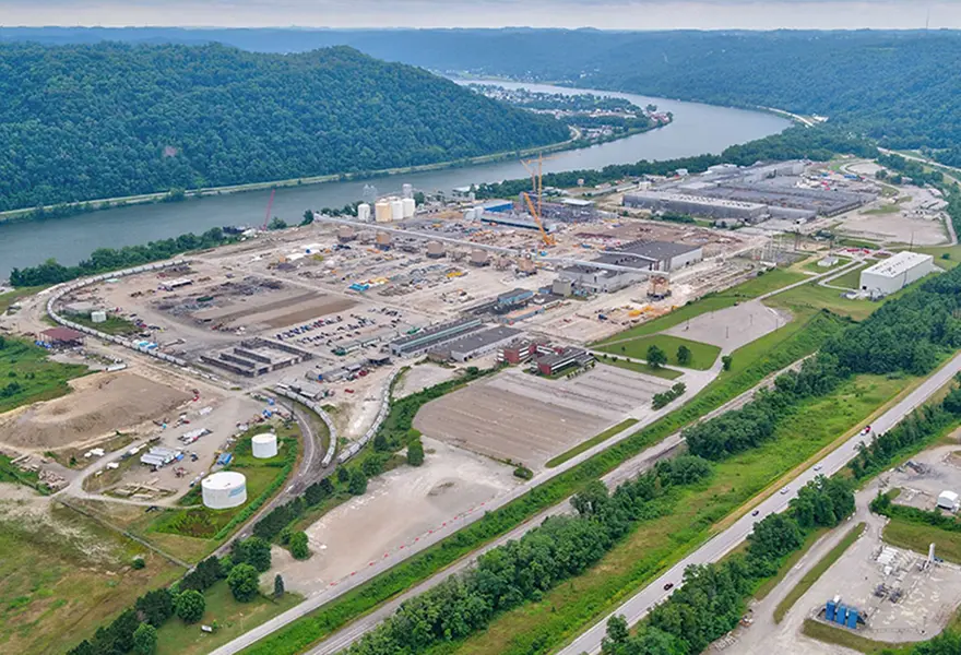 Site overview during power plant construction, looking southeast