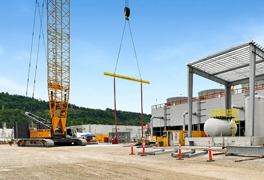 Construction progress - cooling tower chem feed area, 11,000-ton crawler crane used for HRSG modules